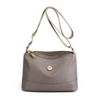 Minimalistisk axel- och crossbodyväska i nylon med stor kapacitet