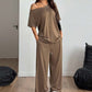 👗 50% RABATT NU! 🌸 Kvinnors Off-Shoulder Topp & Byxor 2-delat Set – Asymmetrisk Topp, Vida Byxor & Andningsbart Tyg ✨