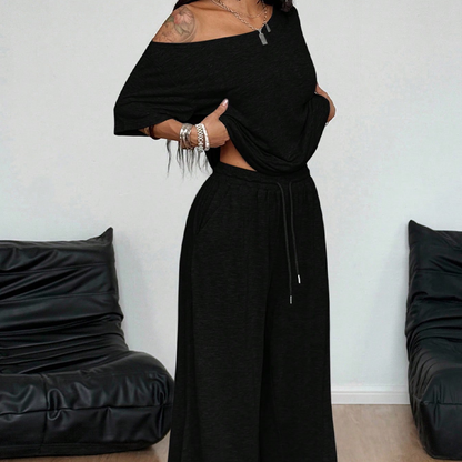👗 50% RABATT NU! 🌸 Kvinnors Off-Shoulder Topp & Byxor 2-delat Set – Asymmetrisk Topp, Vida Byxor & Andningsbart Tyg ✨