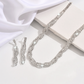 💎Set med halsband och örhängen med glittrande strass och klorformad kedja för kvinnor